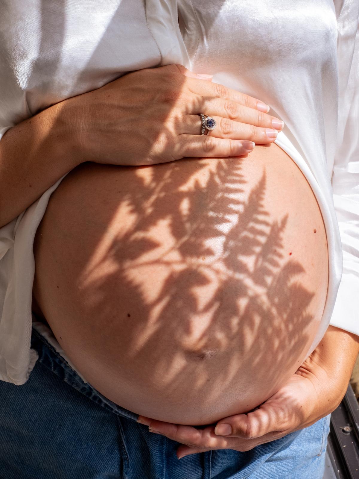 Mother holding her belly